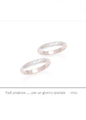 Ro.An. - Coppia fedi in oro bianco e rosa.