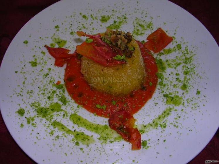 Vellutata di pomodori con soufflè di patate presso il Ristorante Il Portico